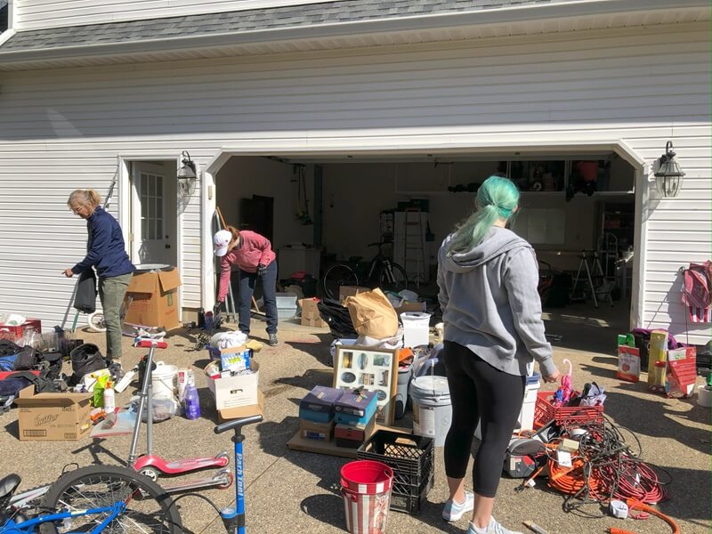 The Consider It Done team working on a downsizing project in Bloomington, they are reviewing the contents of a garge